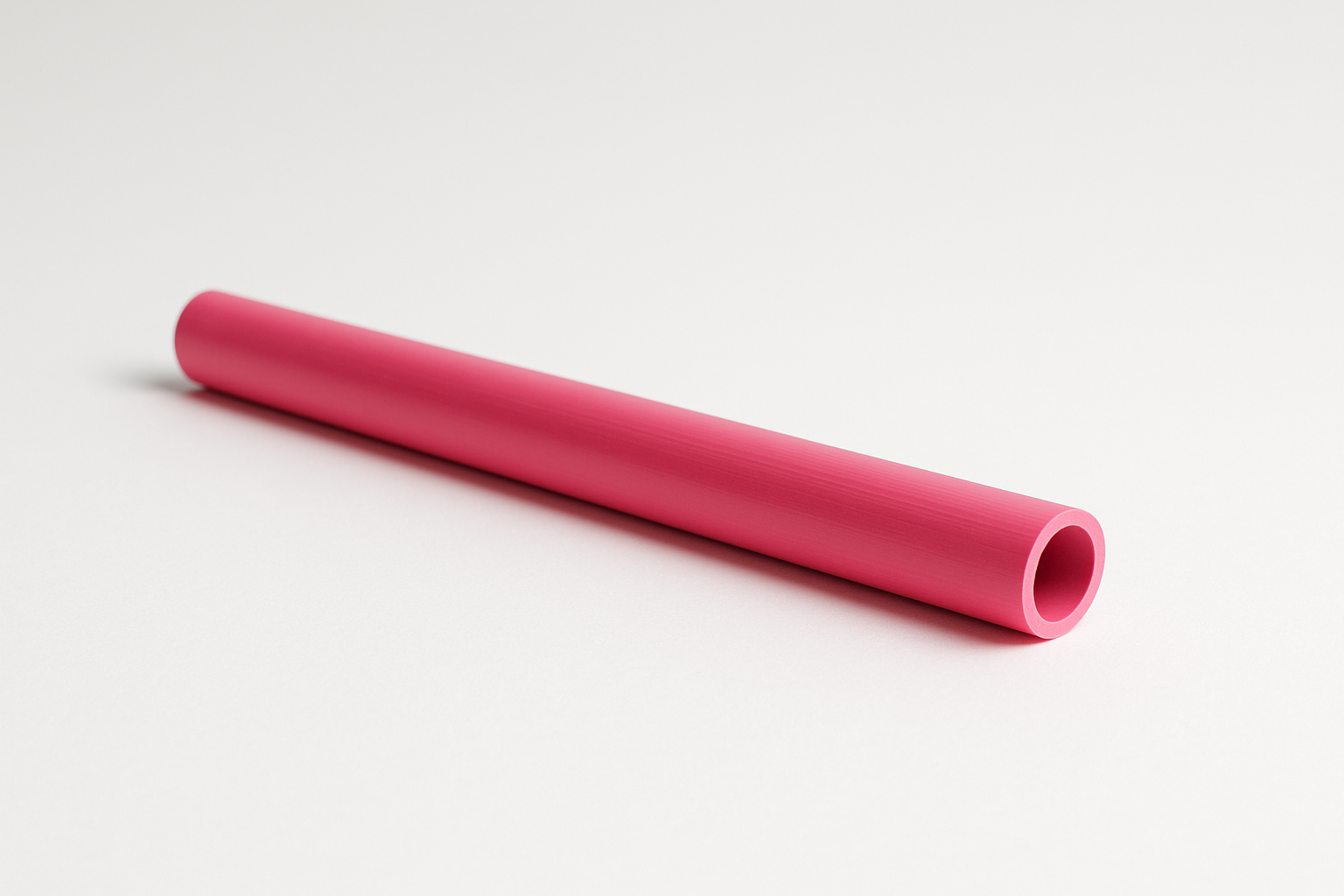 1-foot 1/2 width hollow pvc pipe color pink laying down and displaying length